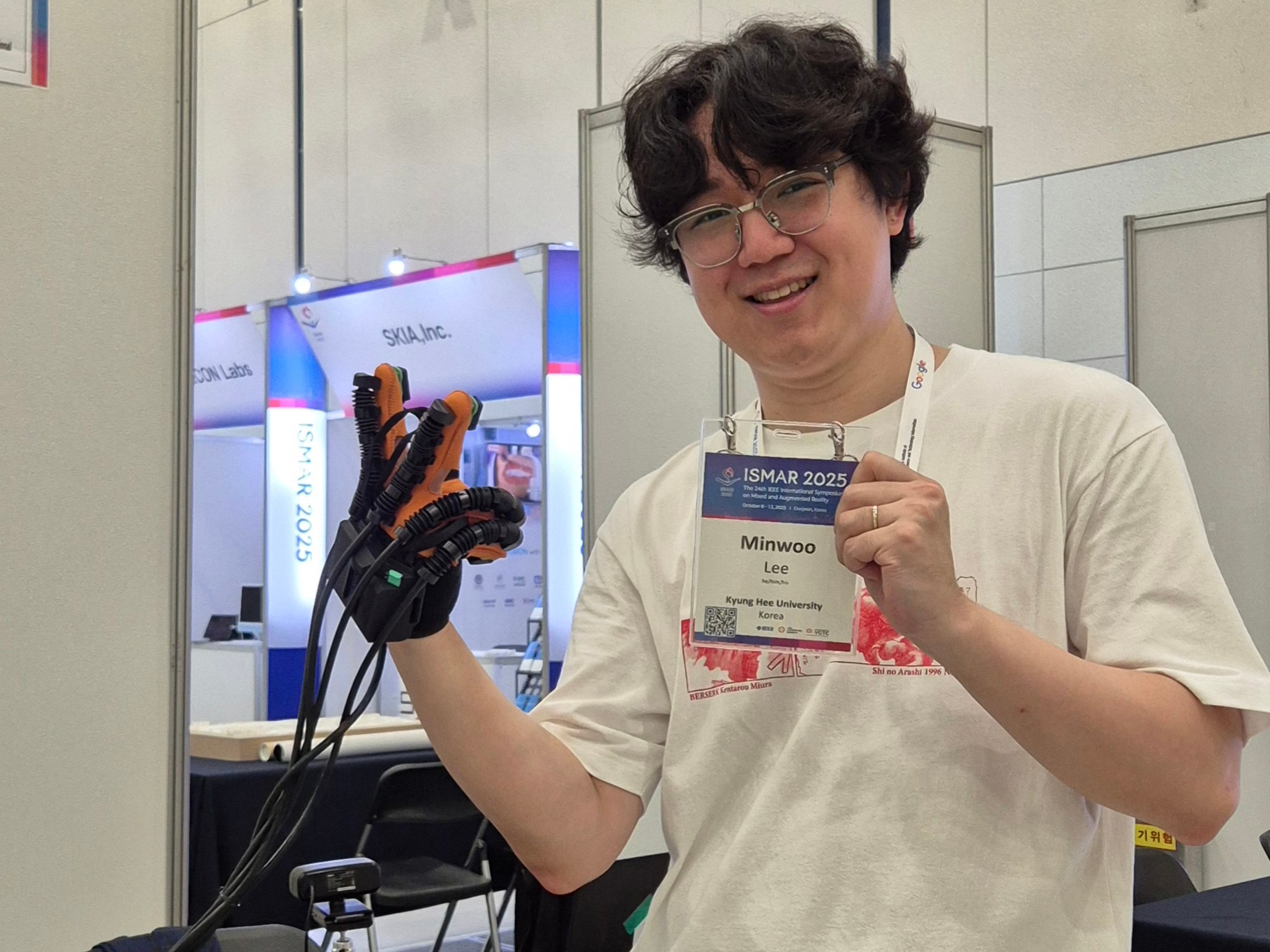 Minwoo Lee at ISMAR 2025 with a haptic glove