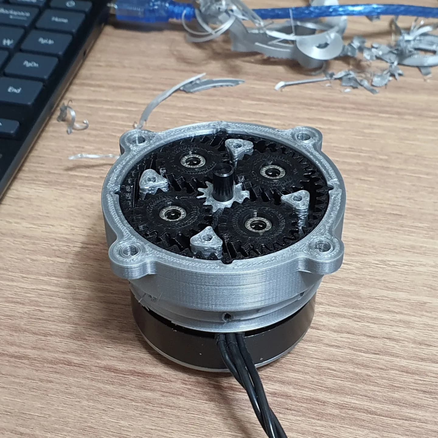 Prototype hardware footage still showing the planetary gear concept in real form